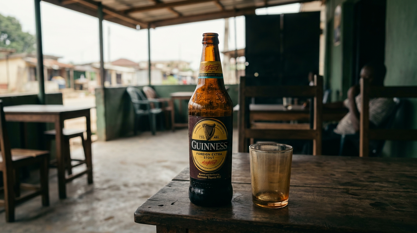 Guinness Foreign Extra Stout bottle and glass in Nigeria.